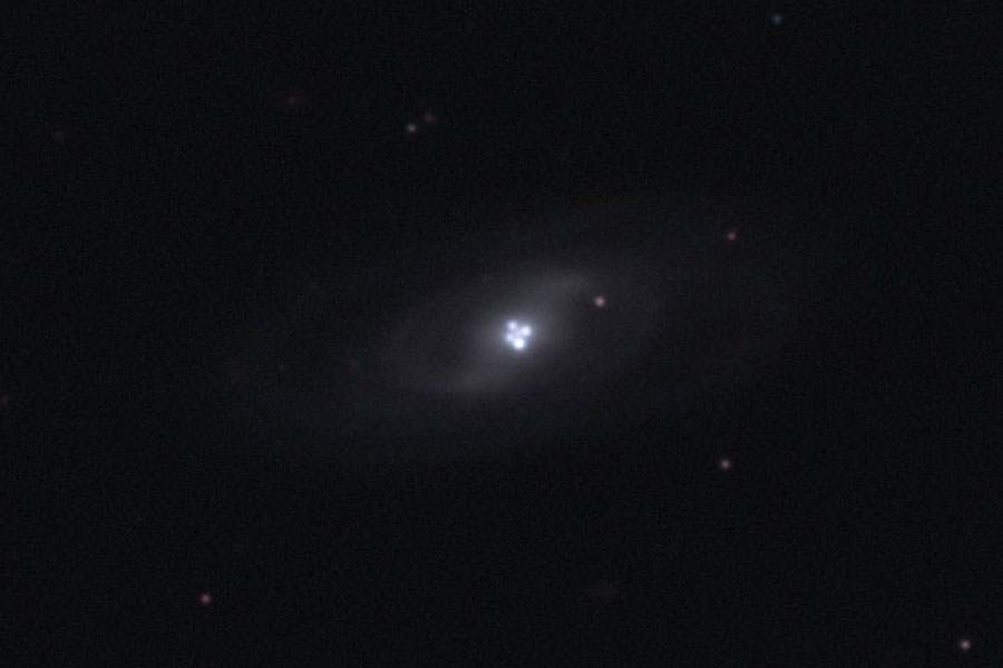 The Einstein Cross Gravitational Lens